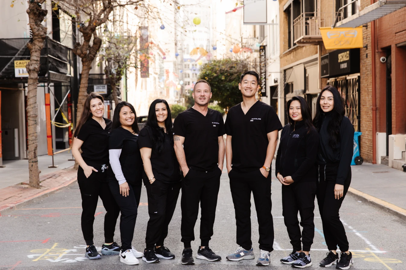 dentist in San Francisco and his team posing for a picture.