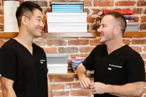 Our dentists discussing a patient's smile makeover in San Francisco