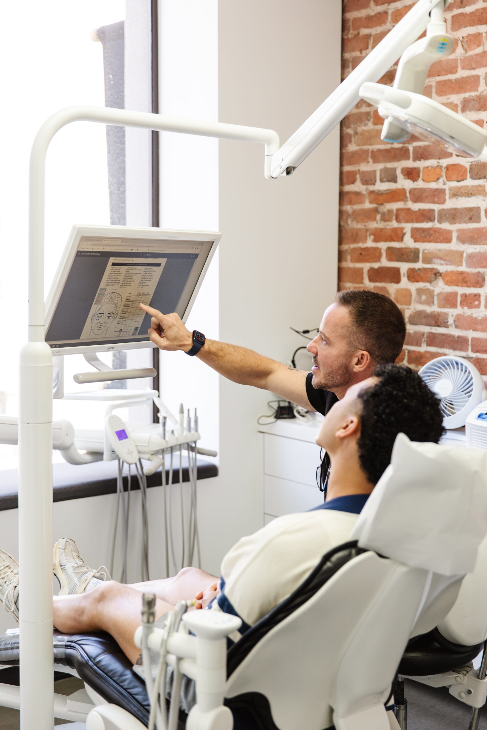 Dr. Cornehl in consultation with a TMJ patient