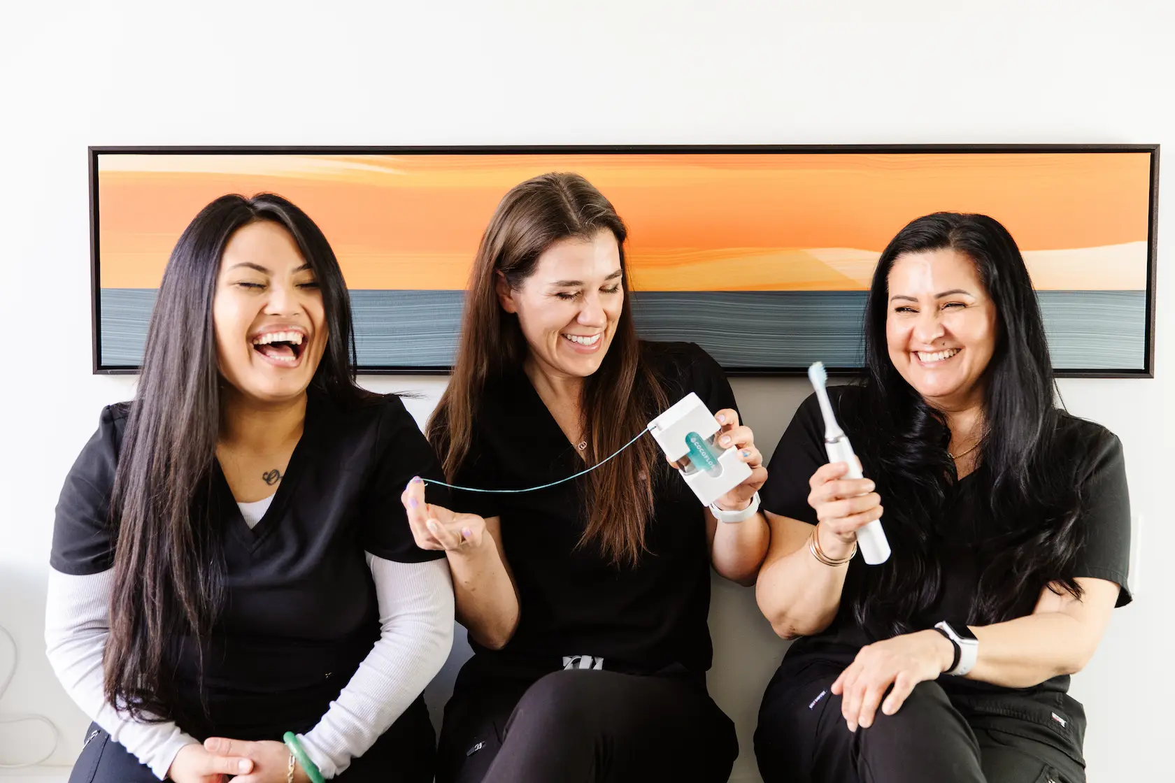 Dental staff smiling and interacting during a first visit at Dental Studio SF